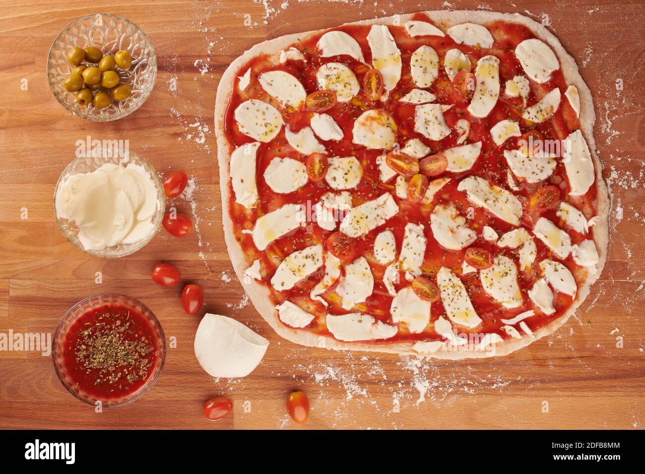 Making italian pizza step by step with ingredients for hand made dough