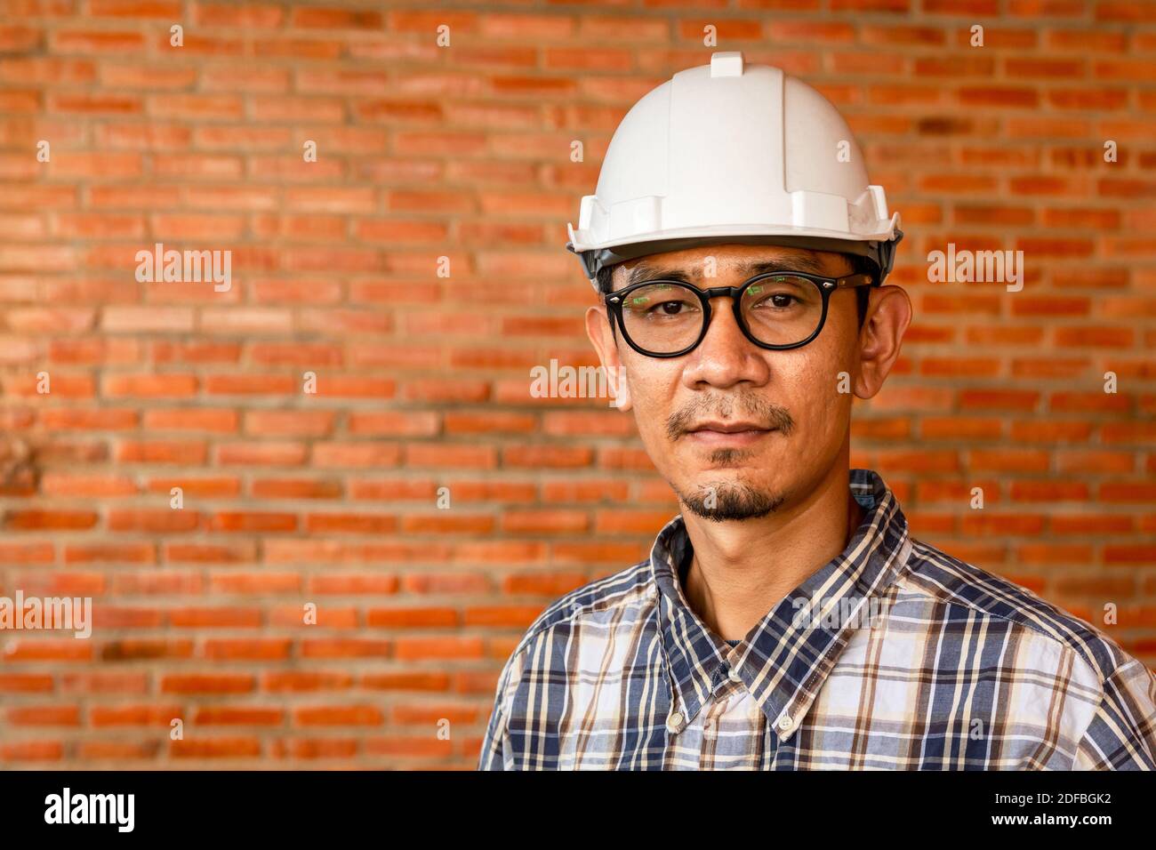 Portrait of professional engineer or architect at construction site. Stock Photo