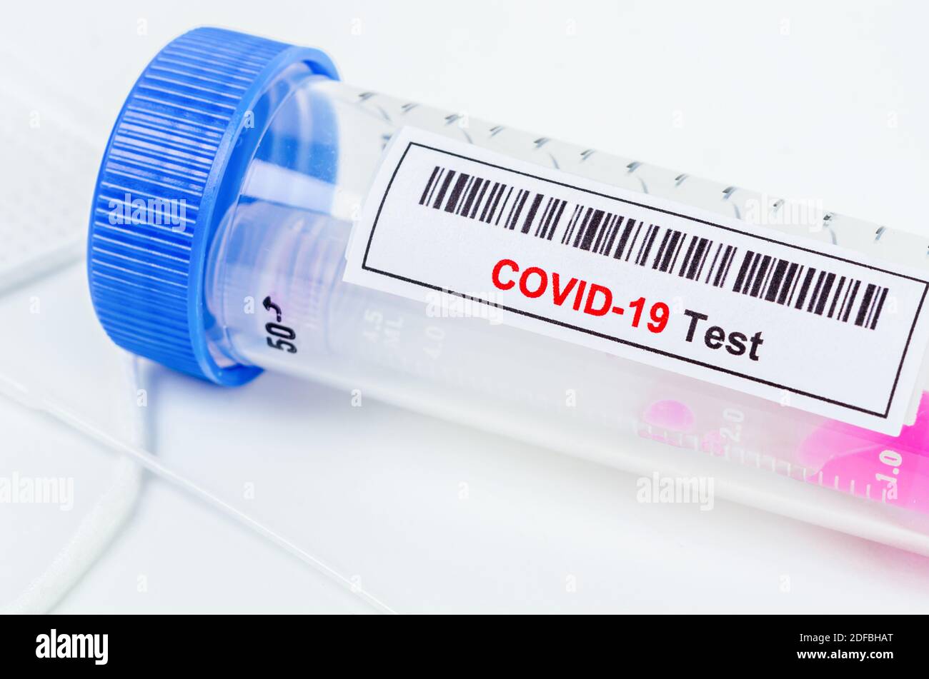 Tube containing nasopharyngeal swab for coronavirus or COVID-19 test in laboratory. Stock Photo