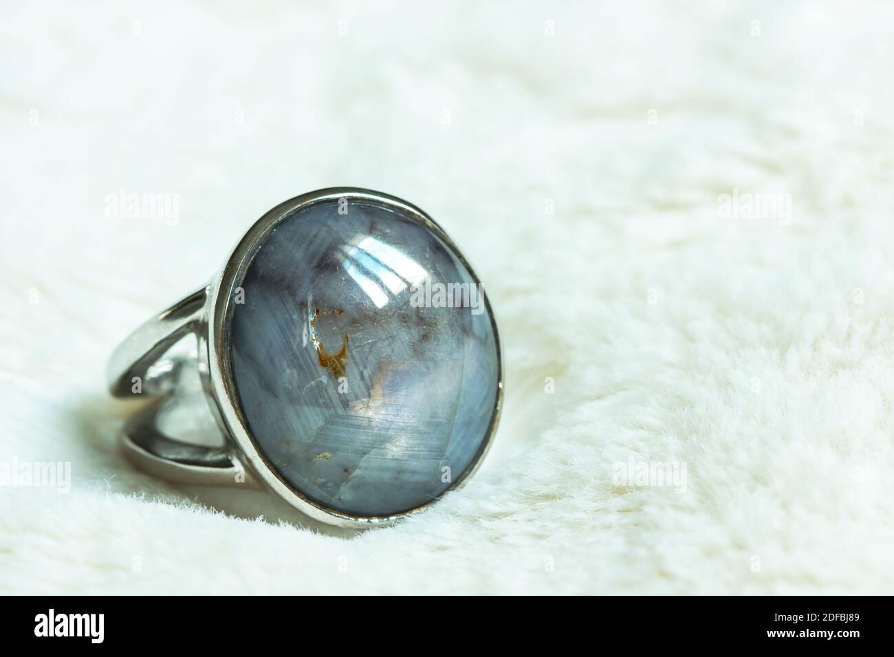 Striped Sapphire On A Silver Ring Stock Photo
