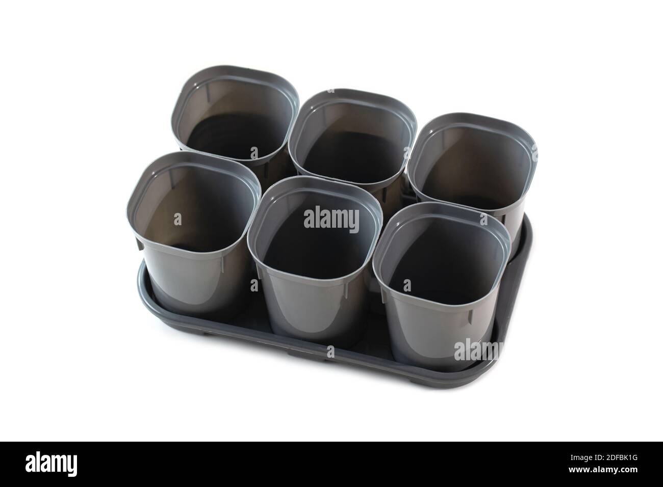 Empty plastic plant pots isolated on white background Stock Photo