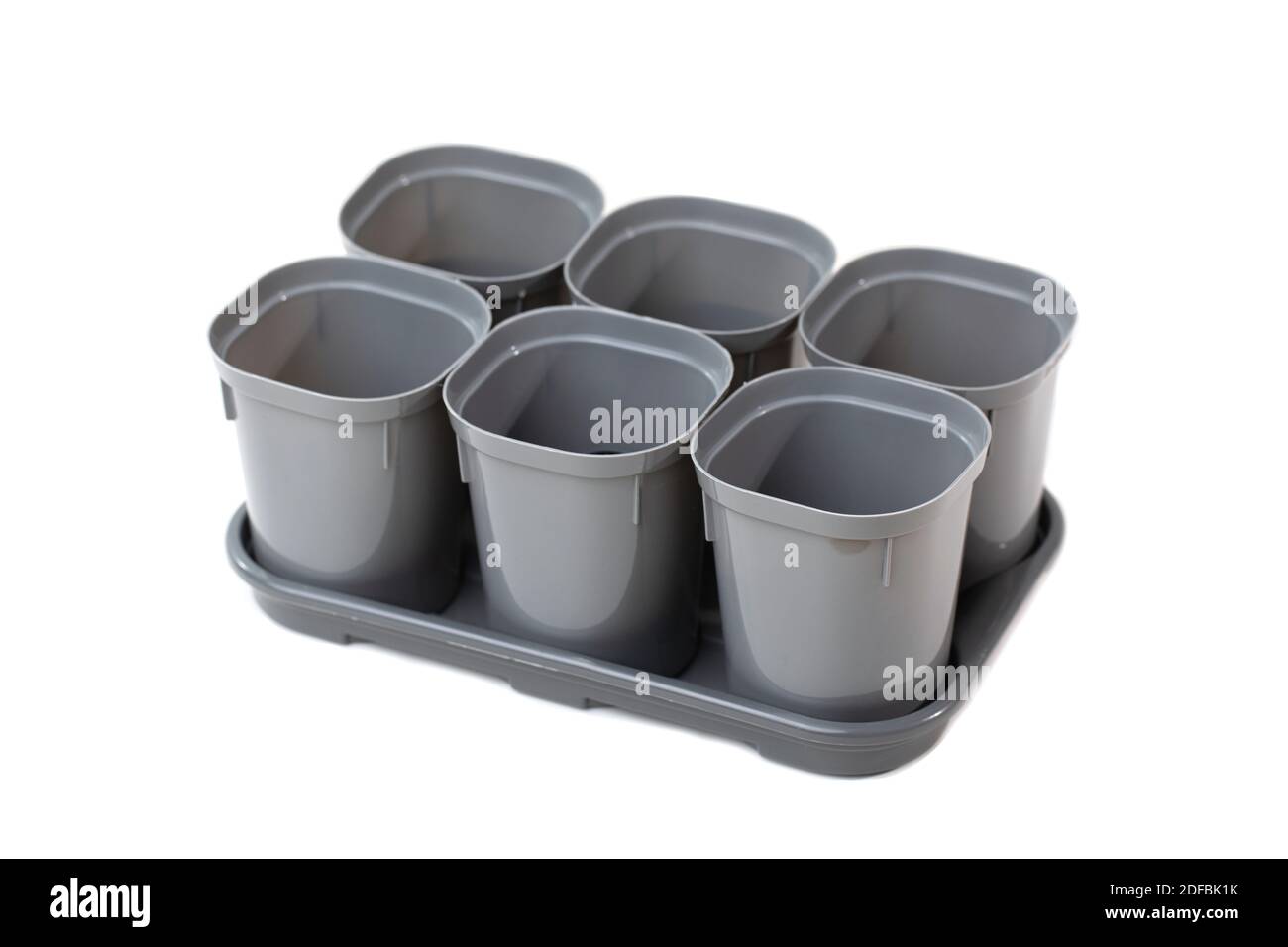 Empty new plastic plant pots isolated on white background Stock Photo