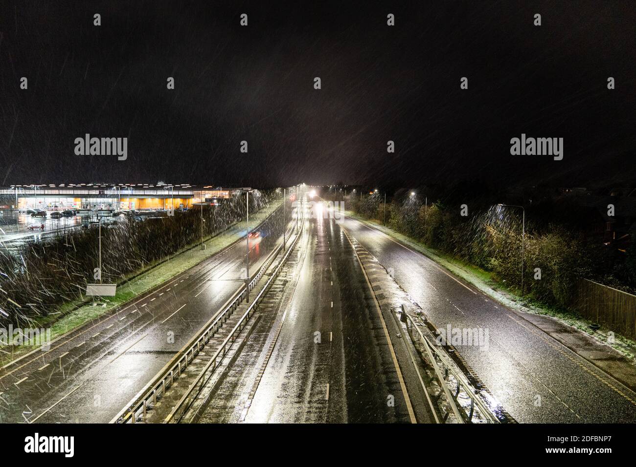 Overhead view of traffic driving at night on the major road, A299