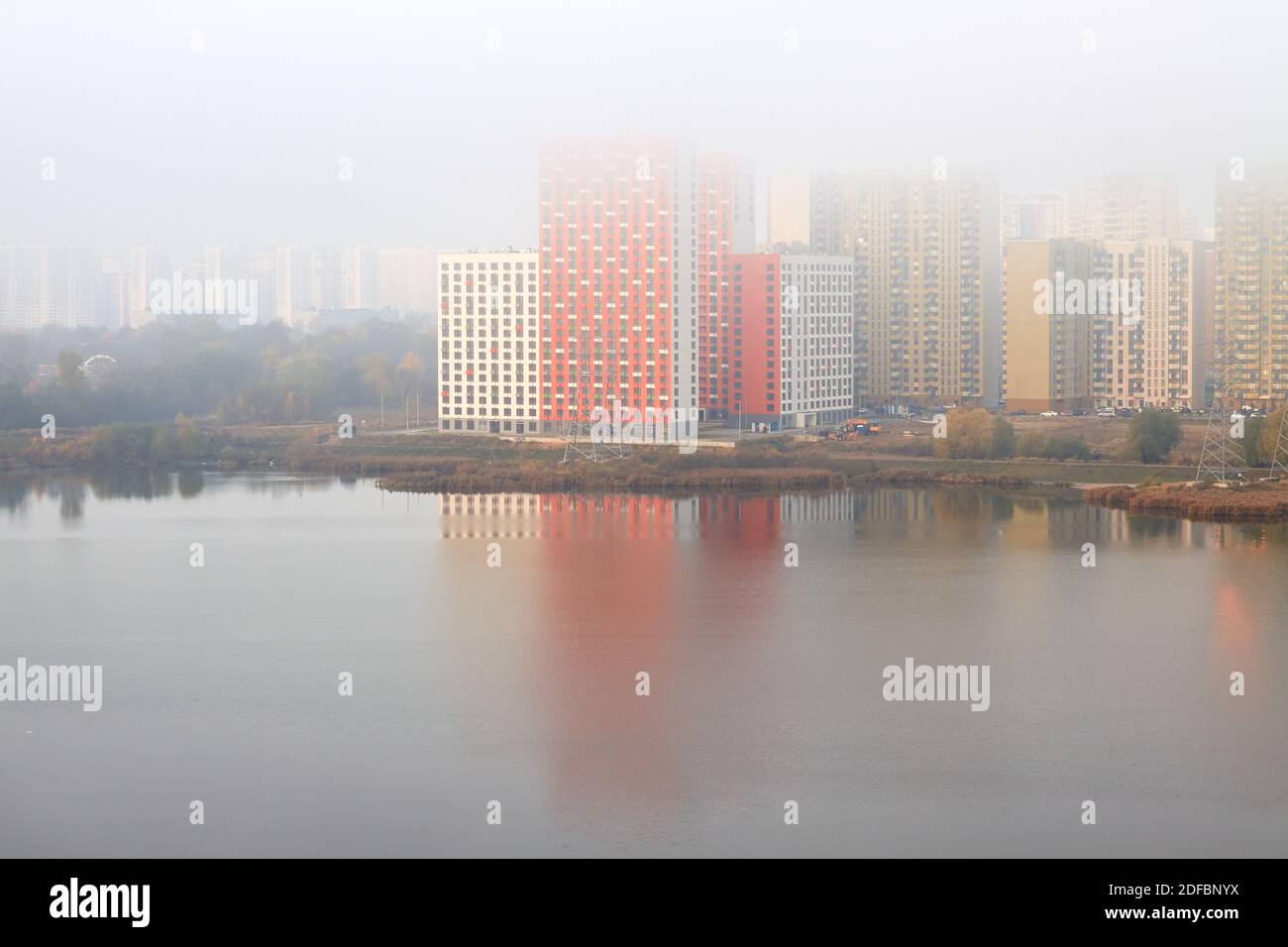 New colored residential buildings in fog Stock Photo