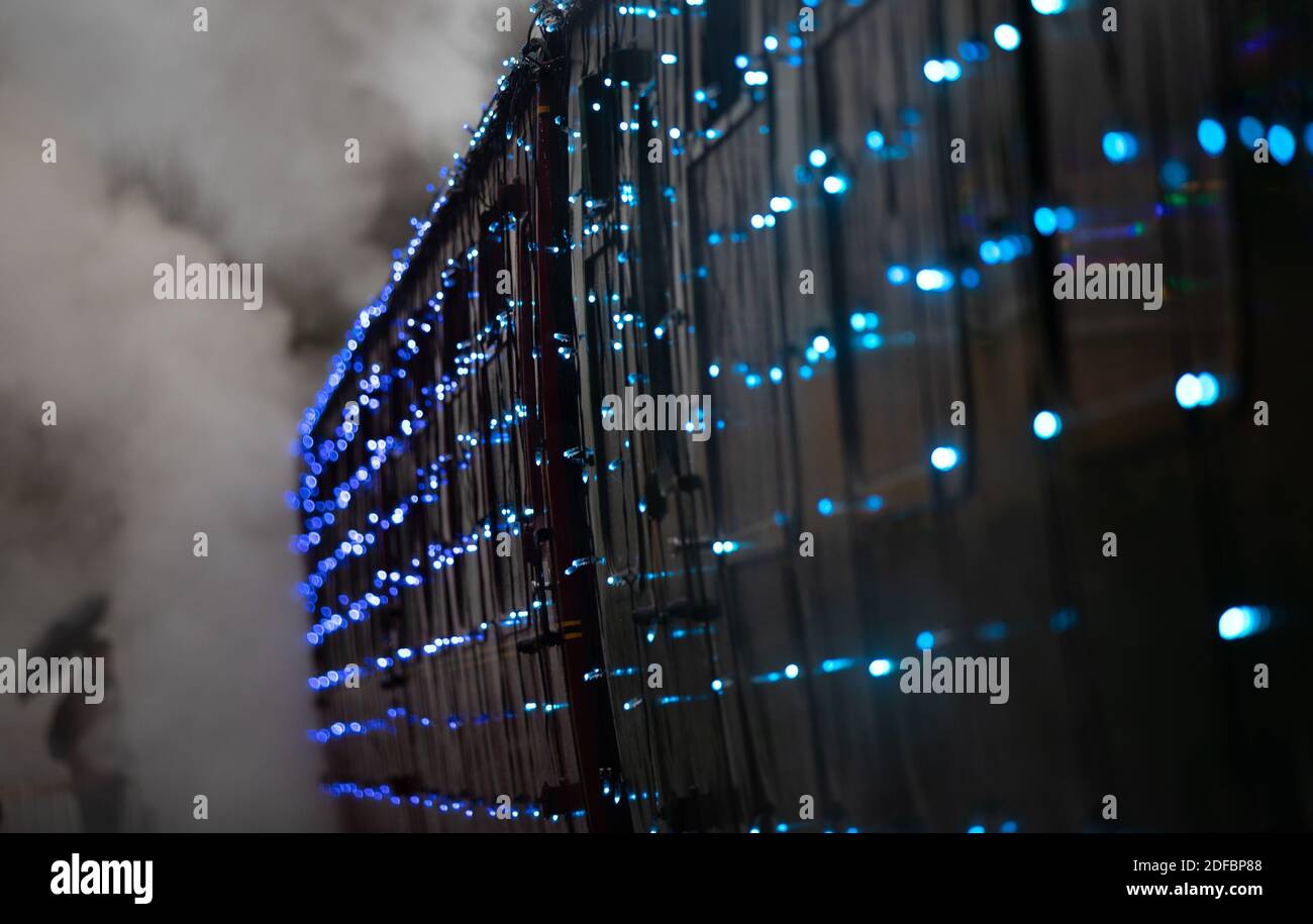 The world's first digital LED train, created using thousands of fully controllable colour mixing LED lights, at Alresford Station in Hampshire during a preview of Steam Illuminations at Watercress Line, which opens to the public on Friday December 4. Stock Photo