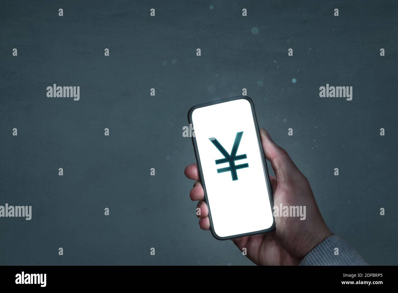 Smartphone screen showing a Japanese Yen symbol Stock Photo