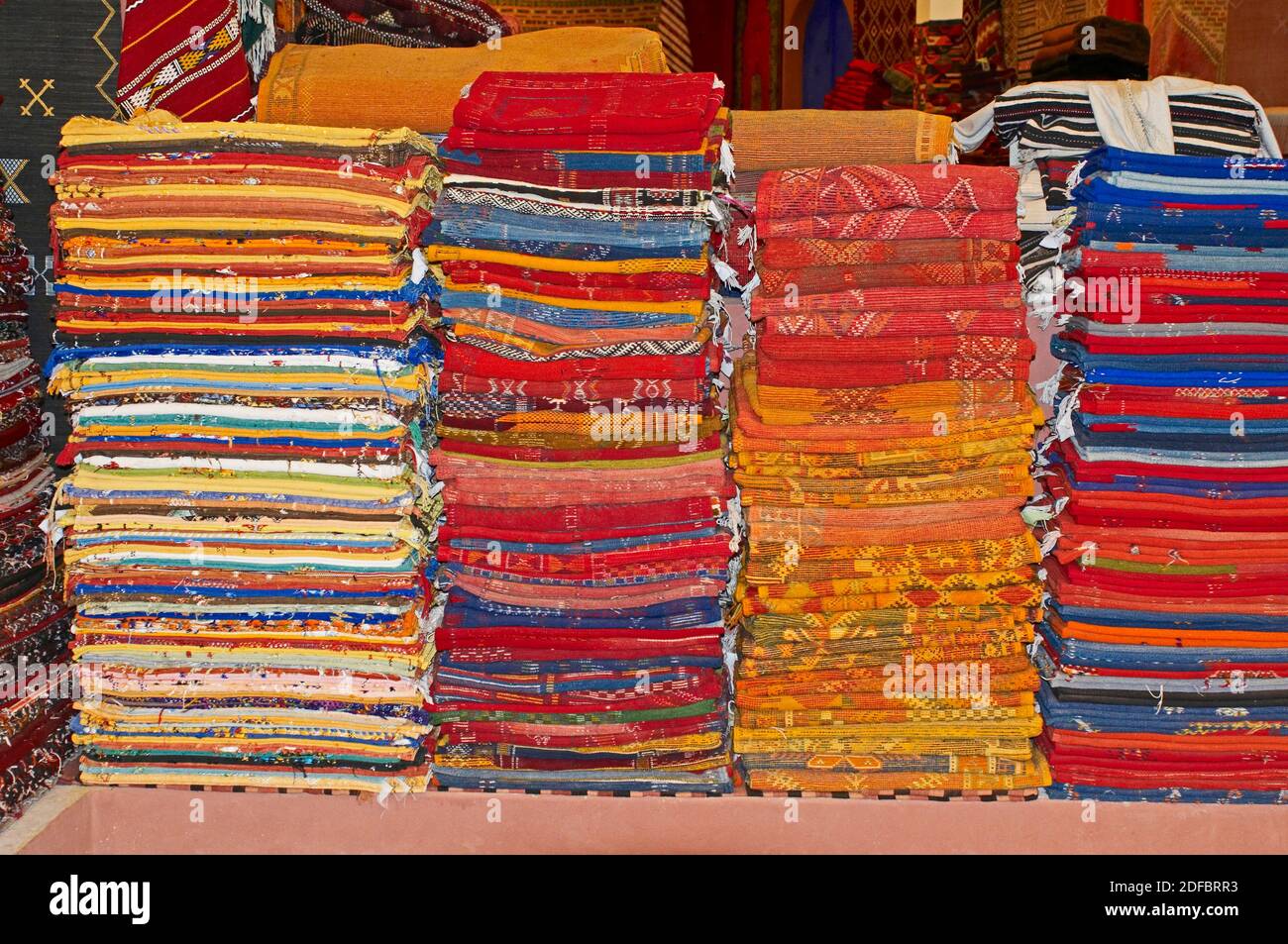 A display of colourful traditioal decorated carpets In the Souk the