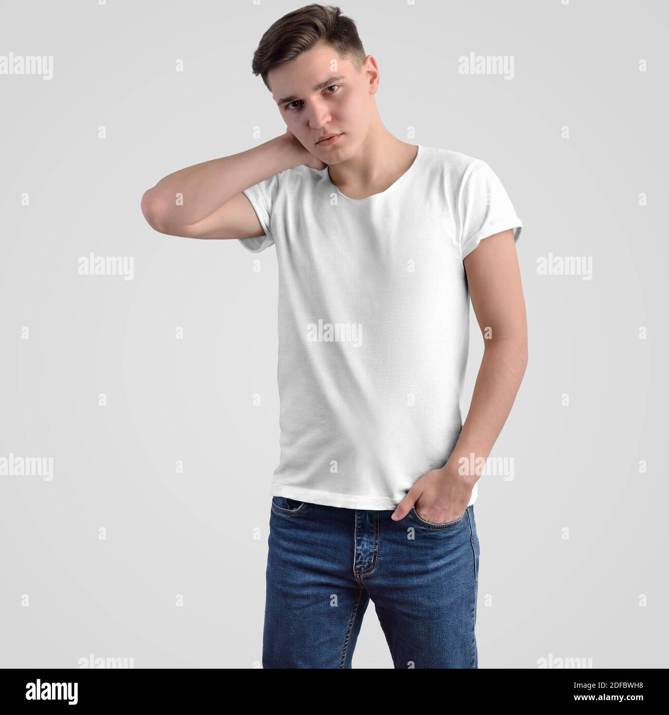 Template white men s t shirt on a young guy on a background in the