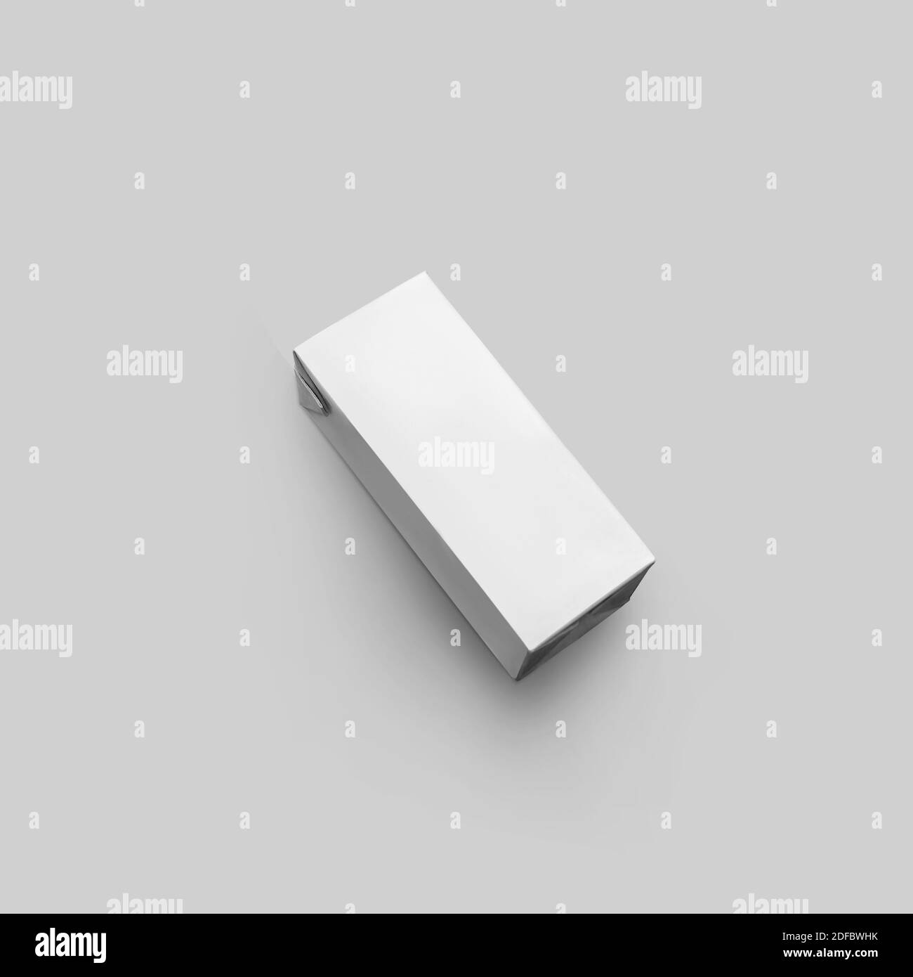 Mockup of paper clean packaging for juice on a white isolated background. Cardboard empty pack template for design presentation Stock Photo