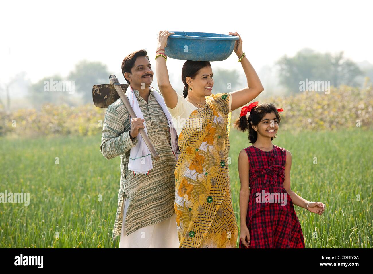 Happy Indian family in agricultural field outdoor Stock Photo - Alamy