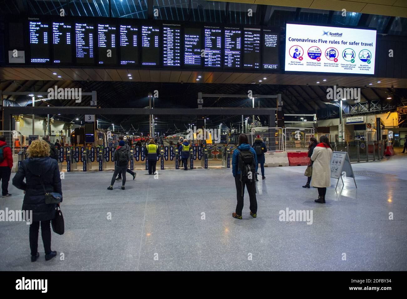Glasgow, Scotland, UK. 4th Dec, 2020. Pictured: Glasgow Queen Street Station, showing fewer passengers due to ScotRail cancelling some services due to the overnight snow. Although there is no snow in Glasgow, fewer rail services have had a knock on effect of people coming into the city. Credit: Colin Fisher/Alamy Live News Stock Photo