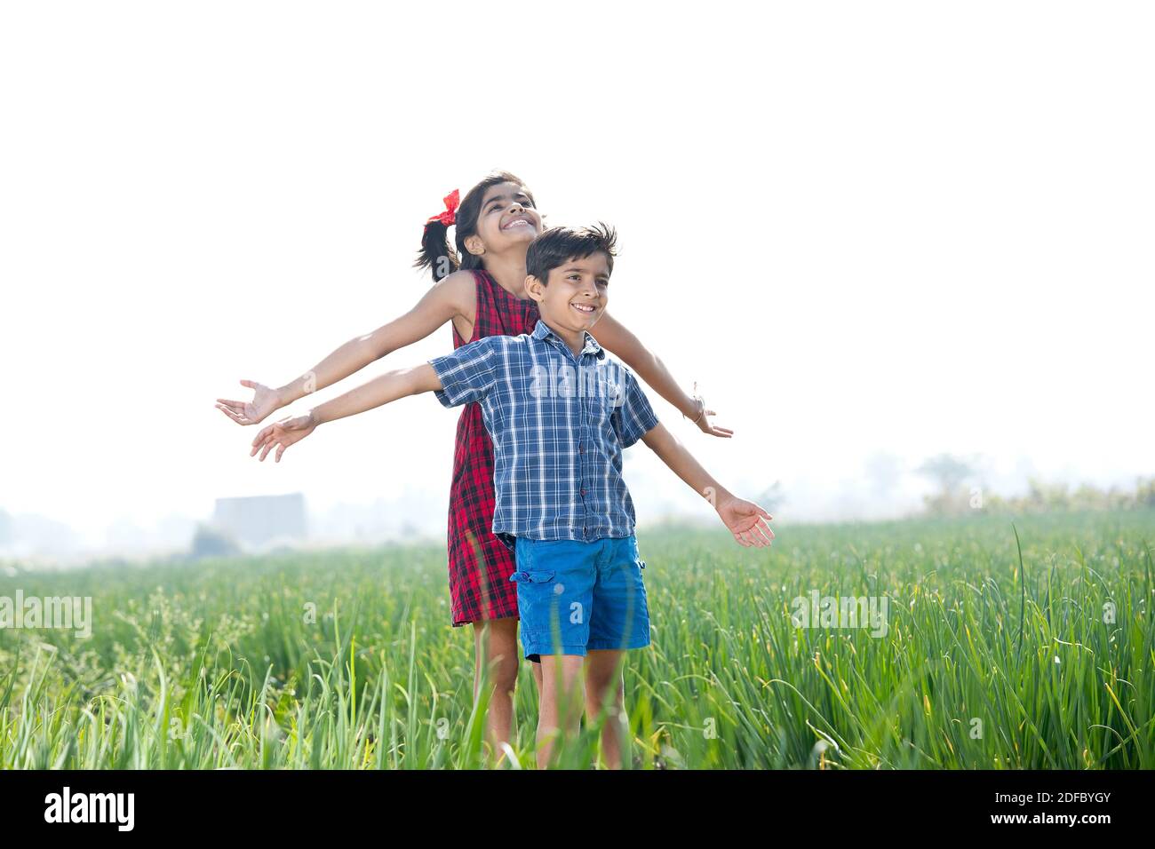 Happy children having fun in agricultural field Stock Photo - Alamy