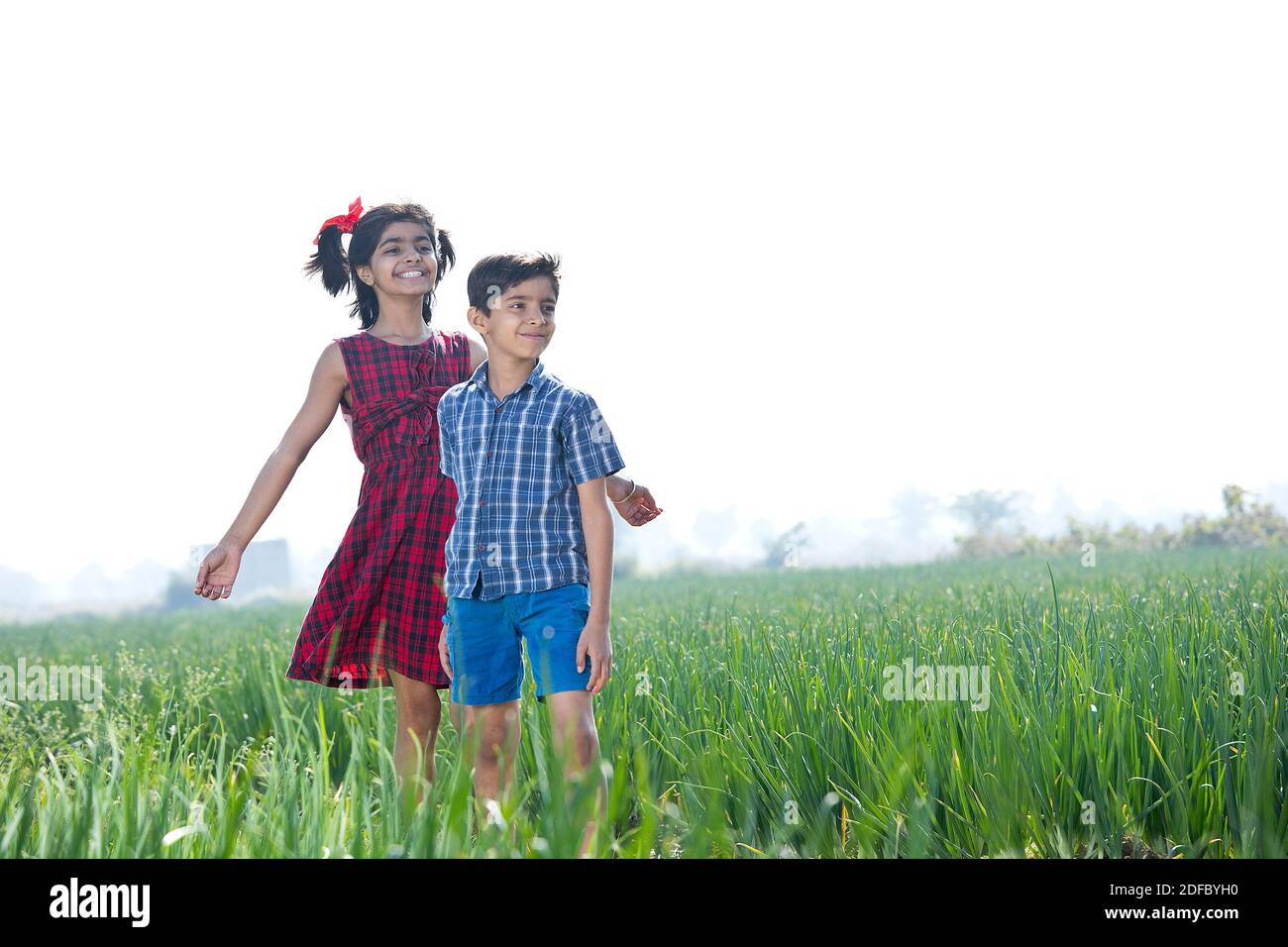 Happy children having fun in agricultural field Stock Photo - Alamy