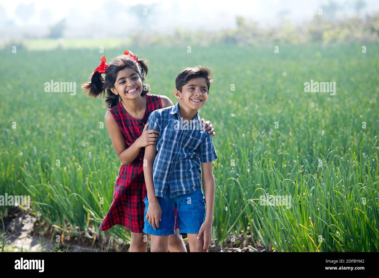 Happy children having fun in agricultural field Stock Photo - Alamy