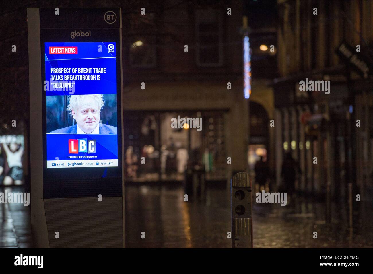 Glasgow, Scotland, UK. 4th Dec, 2020. Pictured: Live news TV screen in Glasgow's city centre showing the UK Prime Minister, Boris Johnson MP, with a headline, PROSPECT OF BREXIT TRADE TALKS BREAKTHROUGH IS ‘RECEDING'. With an empty street in the background during what would normally be a busy morning rush hour street scene. Credit: Colin Fisher/Alamy Live News Stock Photo