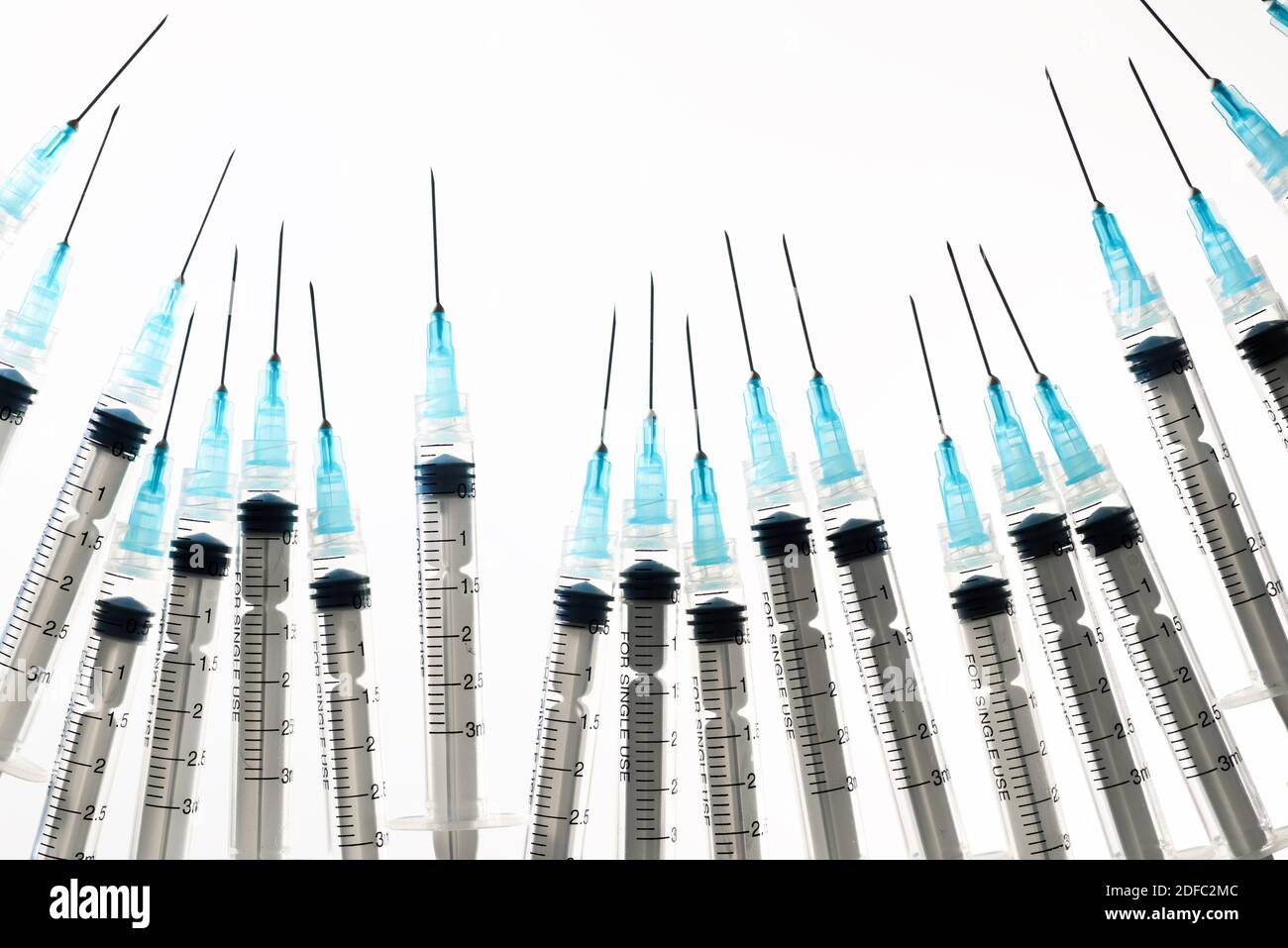 Close up of a group of syringes on a white backlit table Stock Photo ...