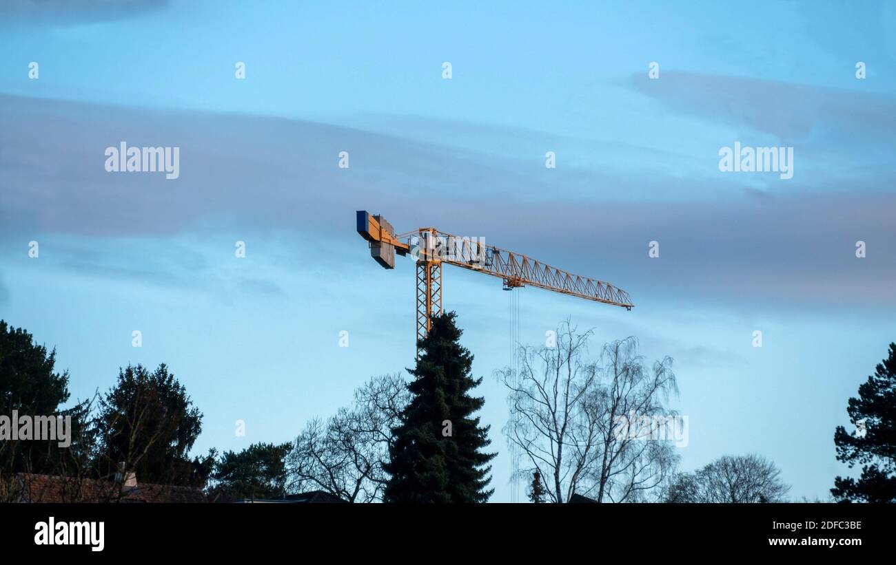 Construction crane in the blue sky Stock Photo