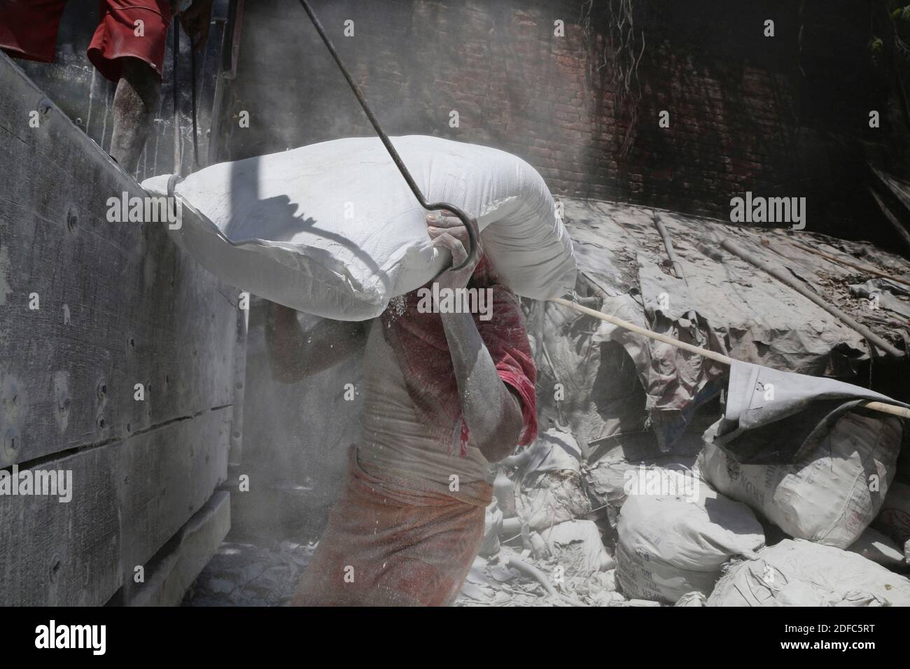 India, worker carrying a bag of heavy cement in Kolkata Stock Photo Alamy