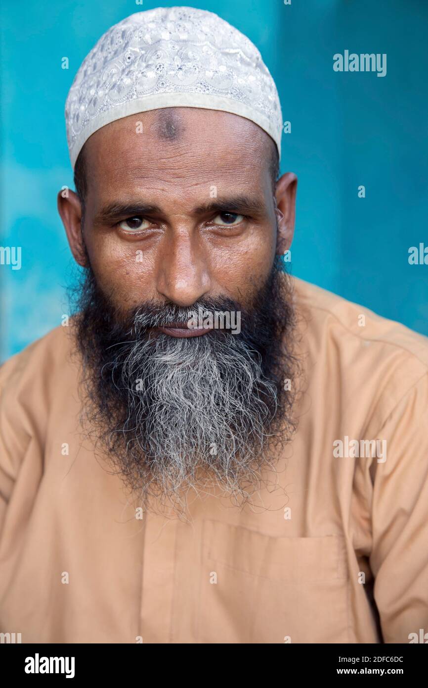 Bangladesh, portrait of muslim man with Taqiyah (cap) and beard and prayer hump (zebibah) in Sreemangal Stock Photo