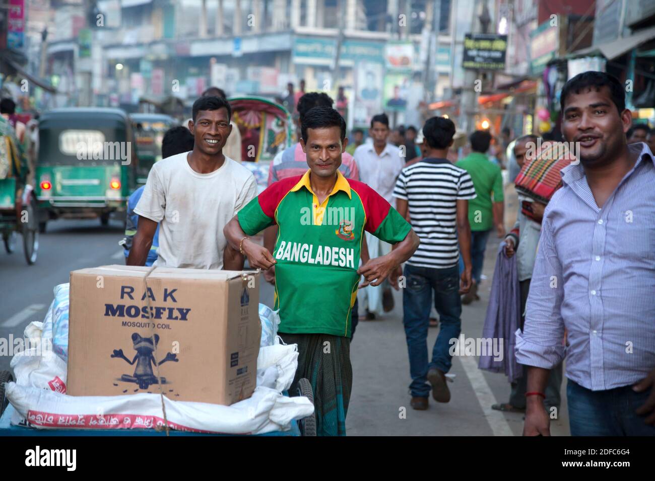 Bangladesh man proudly shows off Bangladesh soccer jersey in Sreemangal Stock Photo