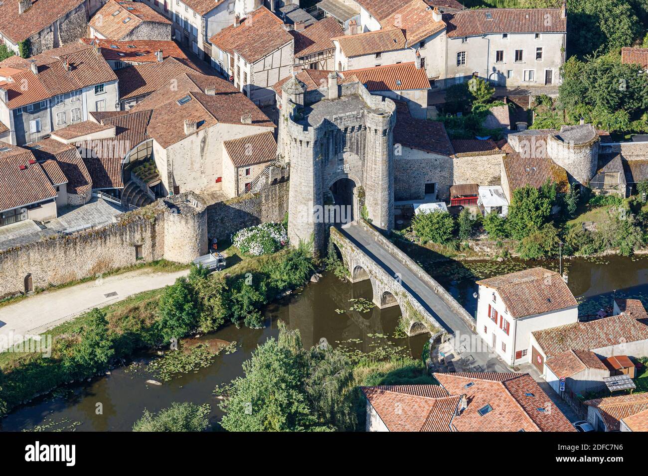 France, Deux Sevres, Parthenay, St James gate and bridge on Le Thouet river (aerial view) Stock Photo