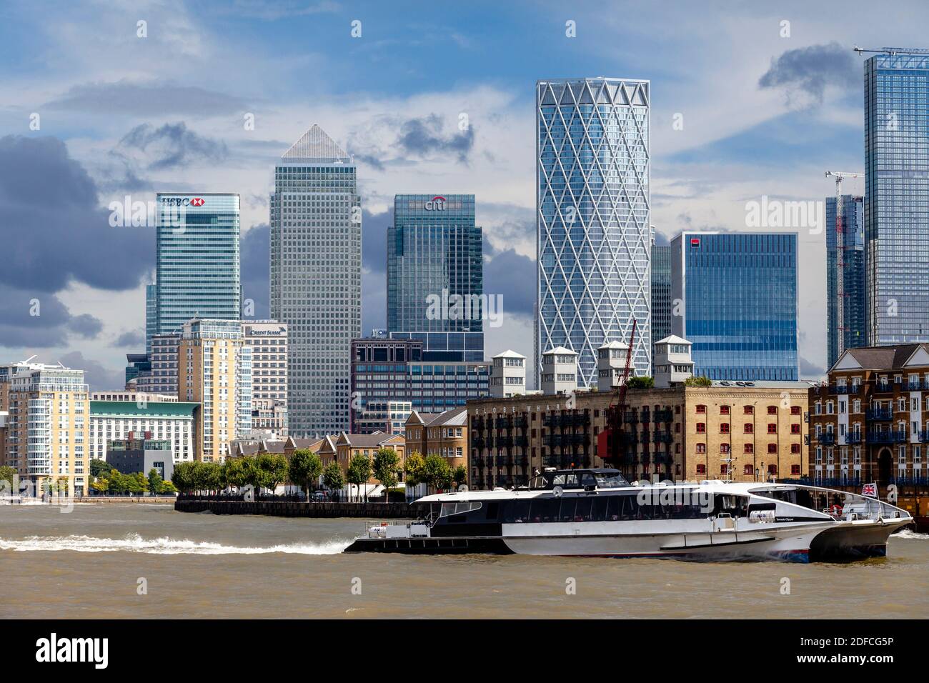 A Thames Clipper Passes The Canary Wharf District, London, UK. Stock Photo