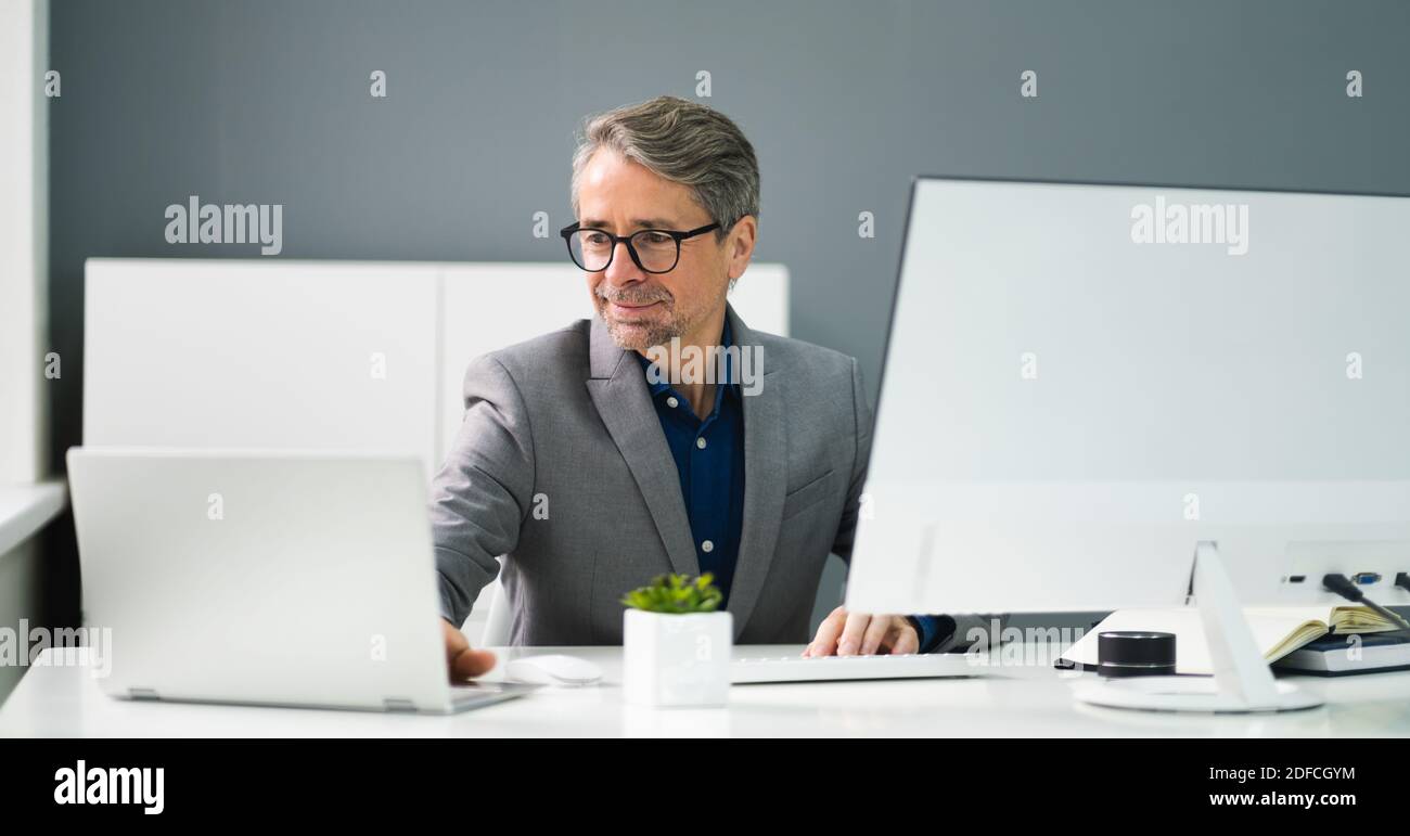 Happy Professional Man Employee Using Computer For Work Stock Photo - Alamy