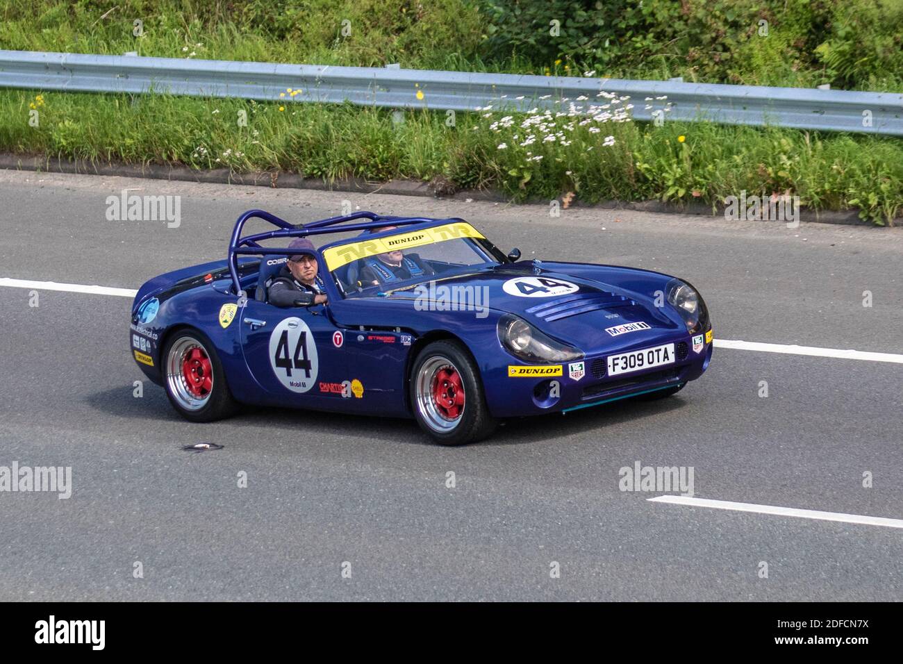 1989 80s eighties blue No.44 TVR Tuscan Challenge Racer 4.4 V8 Rover motorsport open-topped racing car; Sports rally cars driving on UK roads, motors, motoring on the M6 motorway highway network. Stock Photo