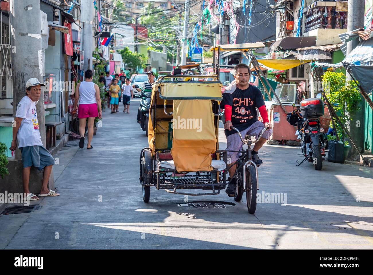 Tricycle taxi at a street in Pasay City, Metro Manila, the Philippines Stock Photo