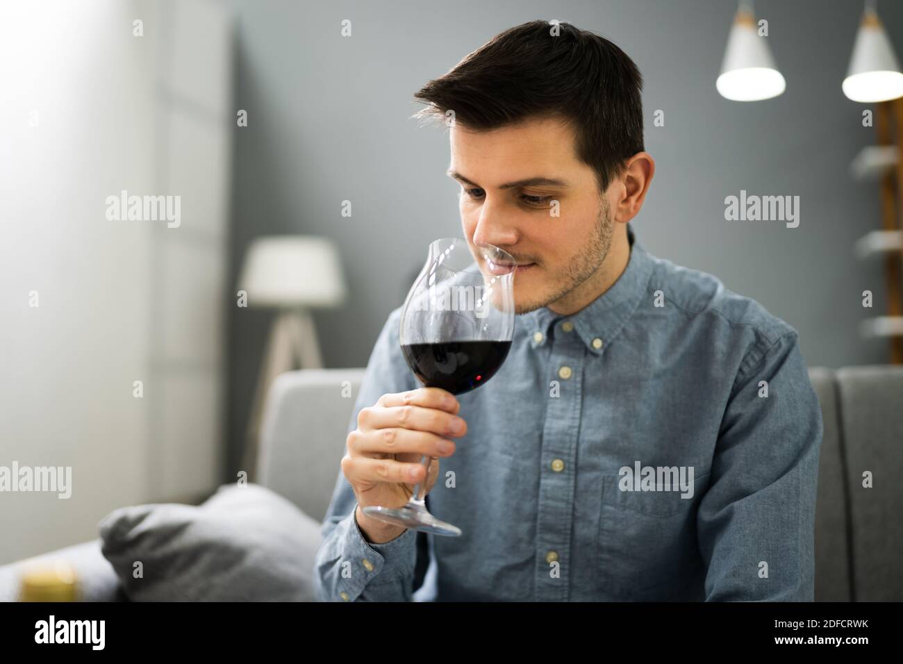 Man Drinking Red Wine In Video Conference At Home Stock Photo - Alamy