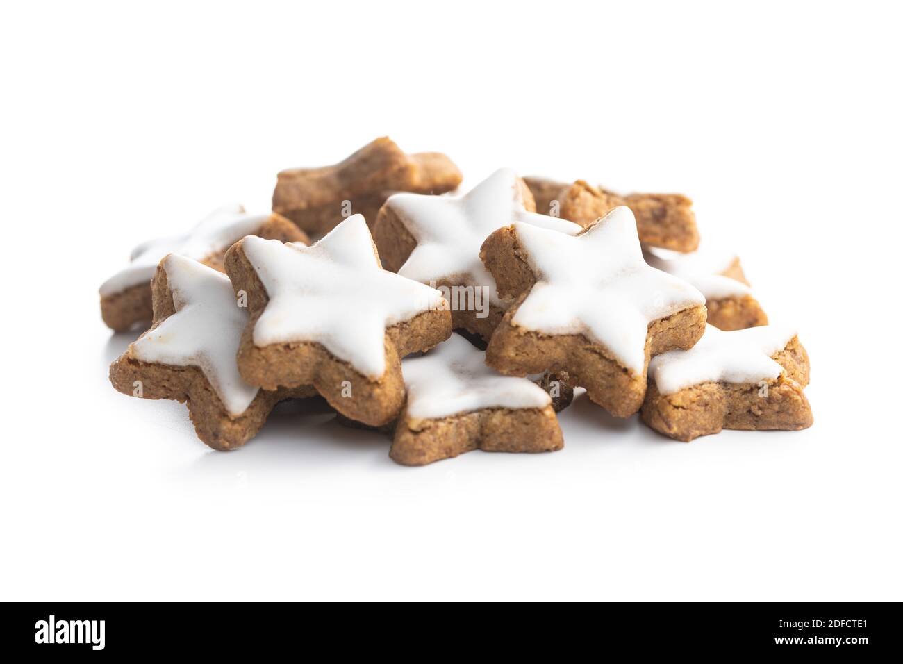 Icing gingerbread stars. Traditional Christmas cookies isolated on ...