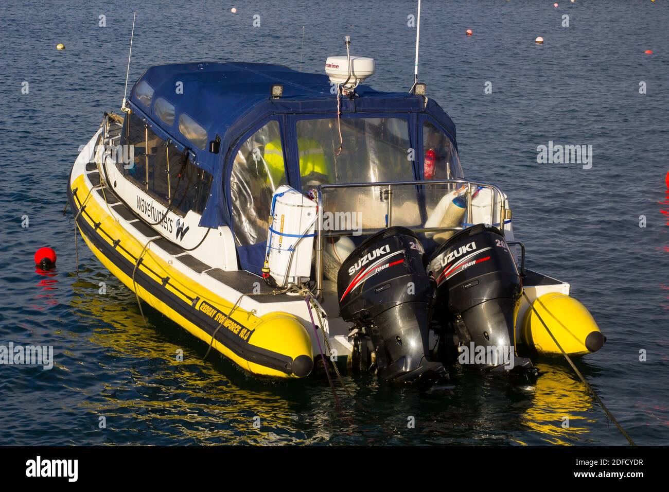 2 December 2020 Donaghadee Harbour and Lighthouse on the Ards Peninsula in Northern Ireland bathed in winter sunshine on a bight yet cold winter after Stock Photo