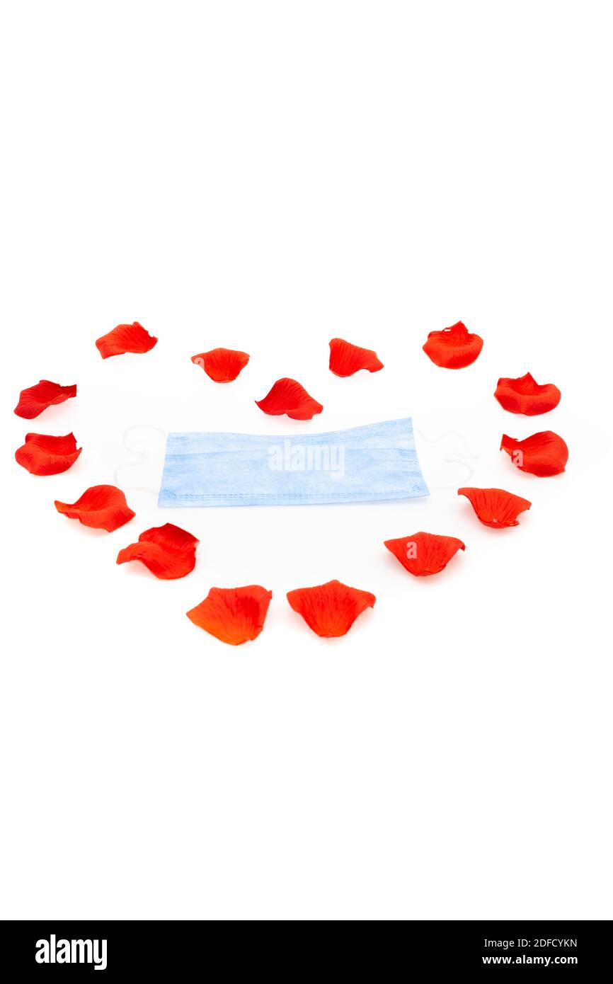 Surgical face mask and red heart shape. covid19 concept. isolated on