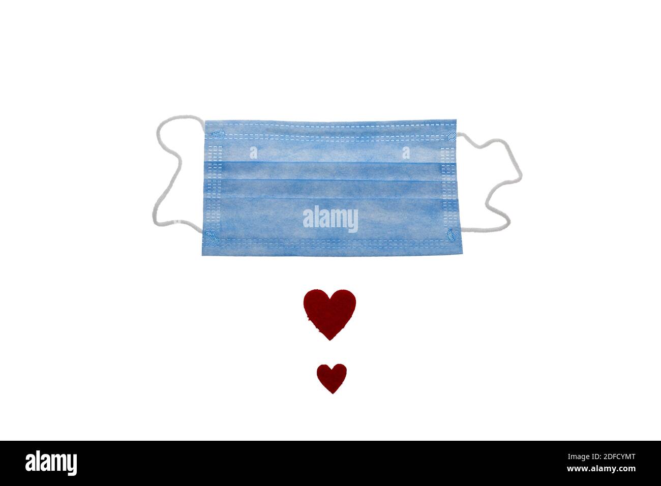 Surgical face mask and red heart shape. covid19 concept. isolated on