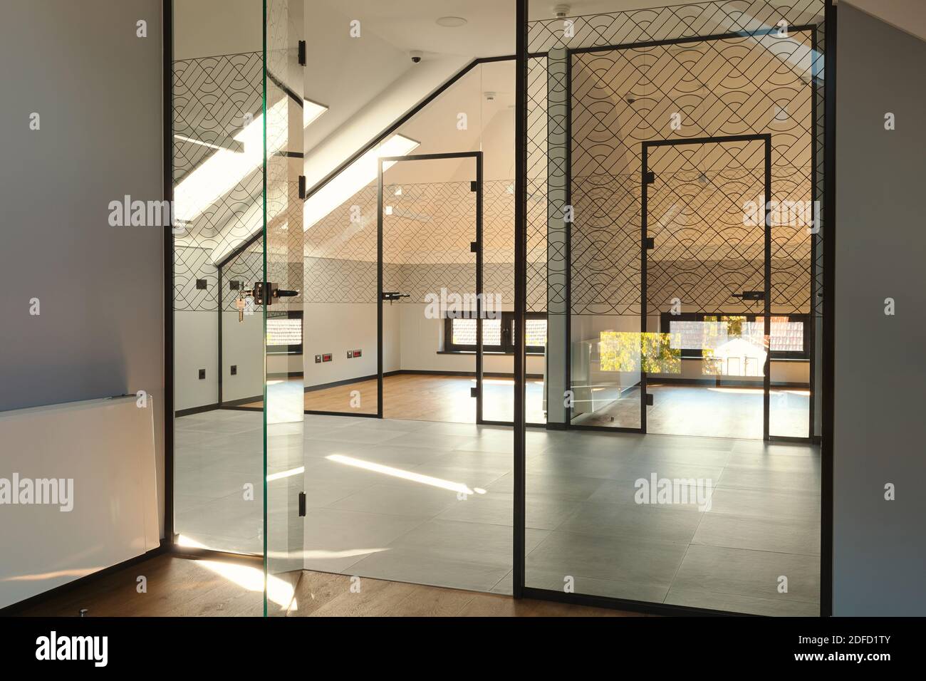 Interior of modern offices, entry walls and doors made of glass, loft