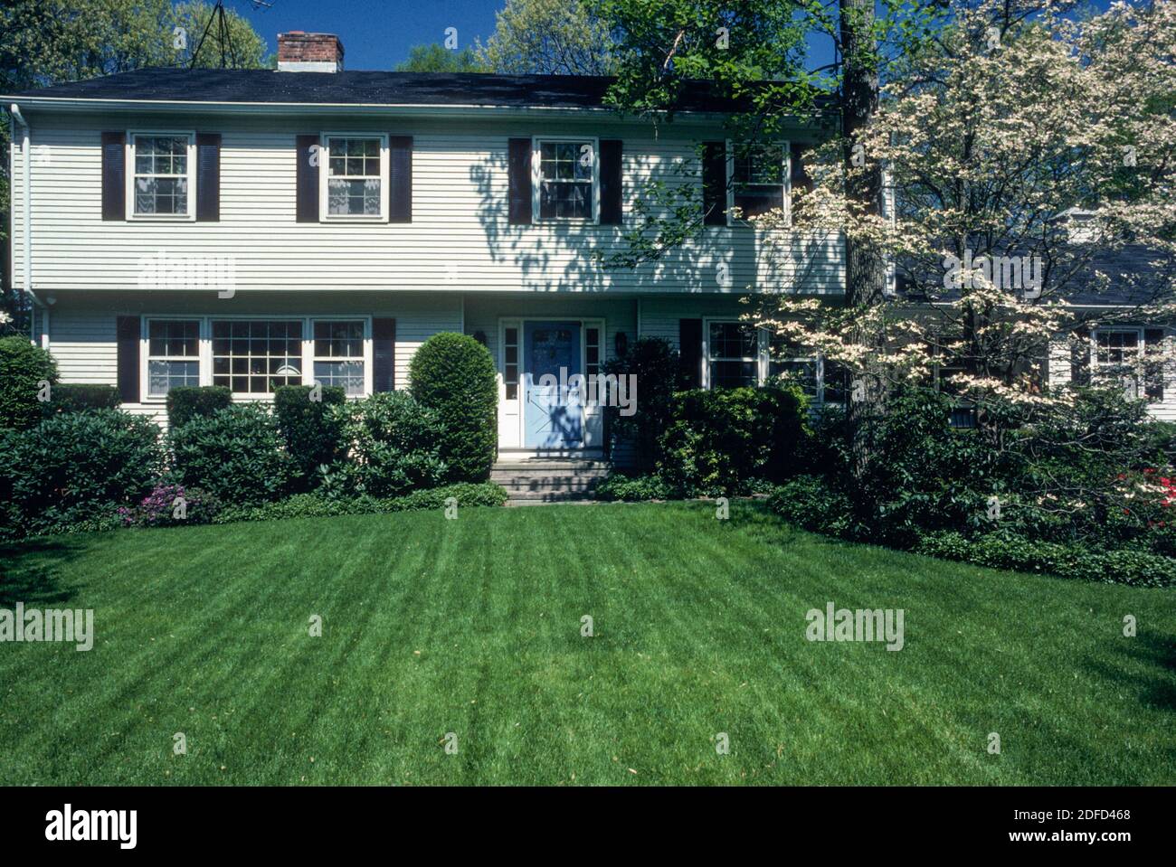 Suburban twostory house in Connecticut is nicely landscaped, USA Stock