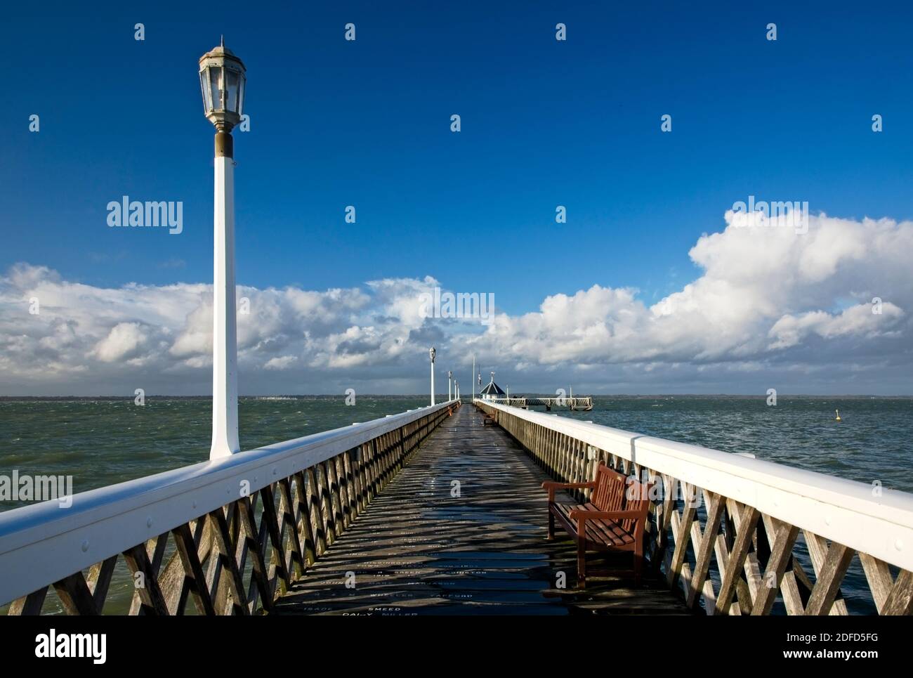 Yarmouth Pier on Isle of Wight bathed in sun after heavy shower Stock Photo
