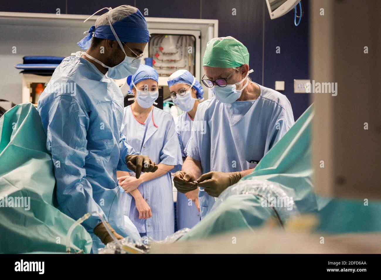 Medical students (external) in the operating room observing a professor and an intern during an operation (Urethrotomy) under endoscopy, Department of Stock Photo
