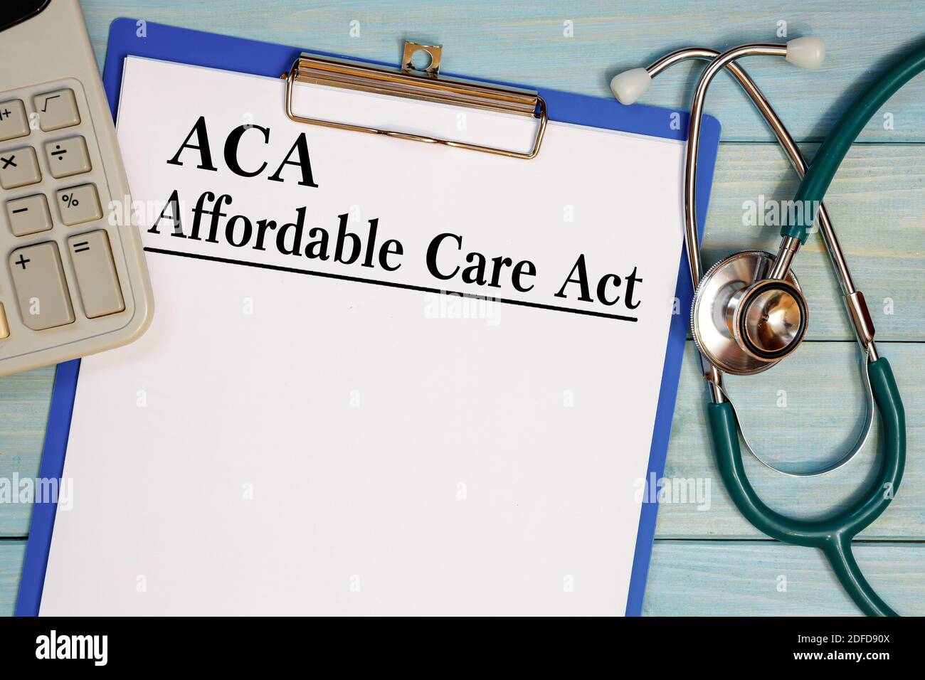 Paper with ACA Affardable Care Act on the office table, calculator and stethoscope. Medical concept. Stock Photo