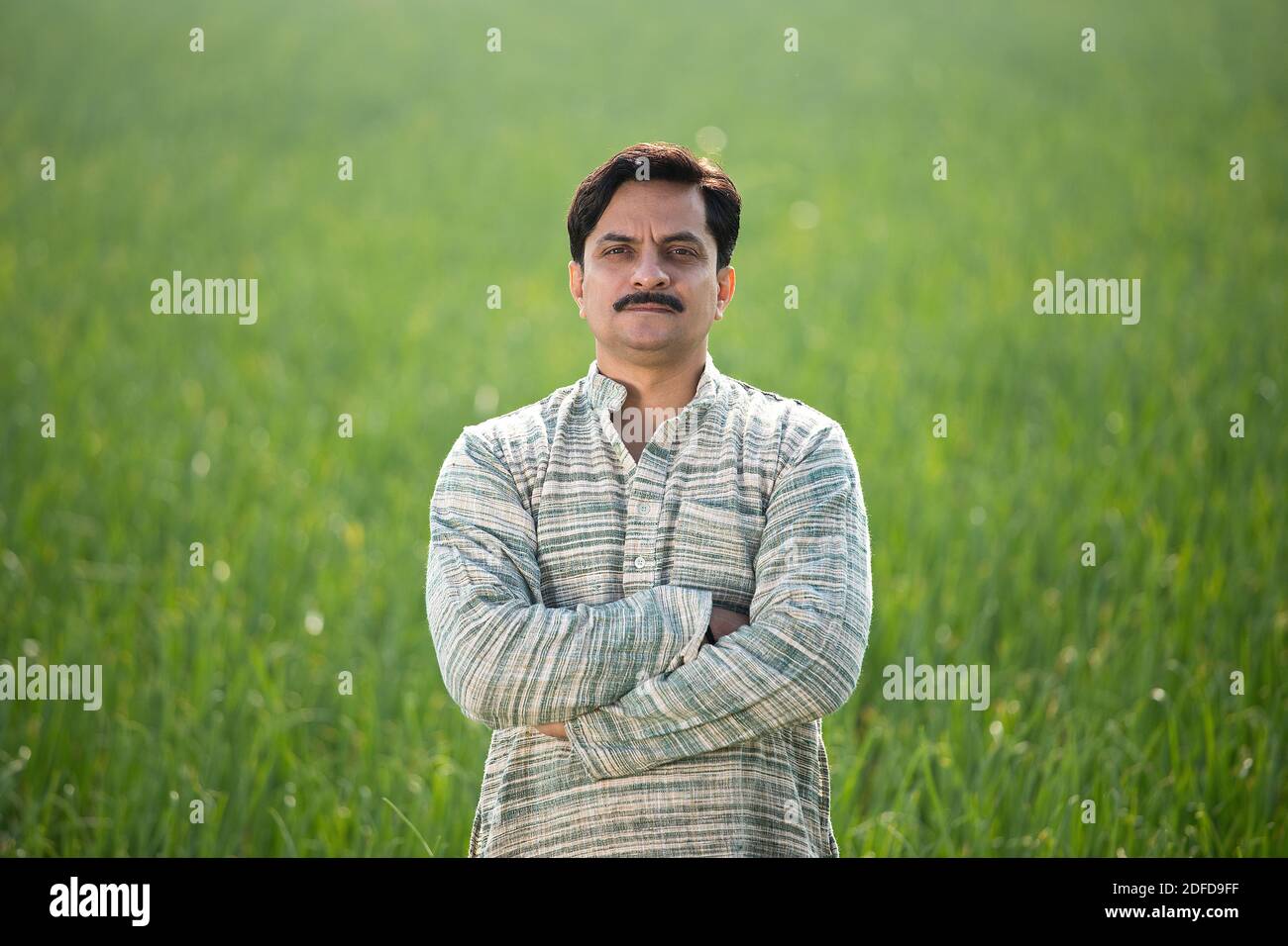 Happy Indian farmer in agricultural field outdoor Stock Photo