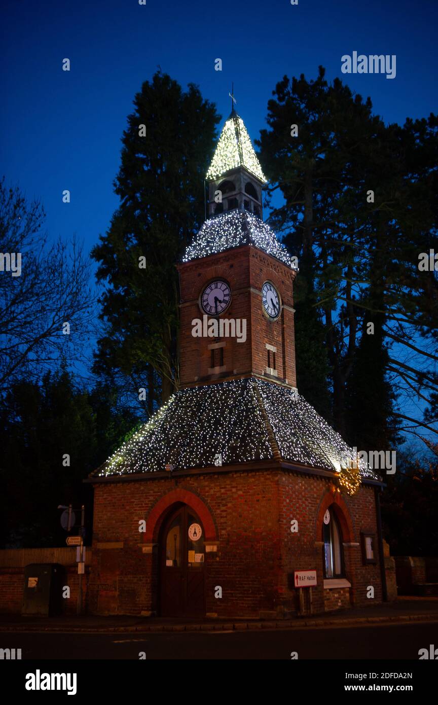 Wendover, Buckinghamshire, UK. 1st December, 2020. The Clock Tower in Wendover sparkles with Christmas lights. Local shops and pubs in Wendover are hoping for a busy December as they reopen after the second Covid-19 lockdown ends and the town goes into Tier 2. Credit: Maureen McLean/Alamy Stock Photo