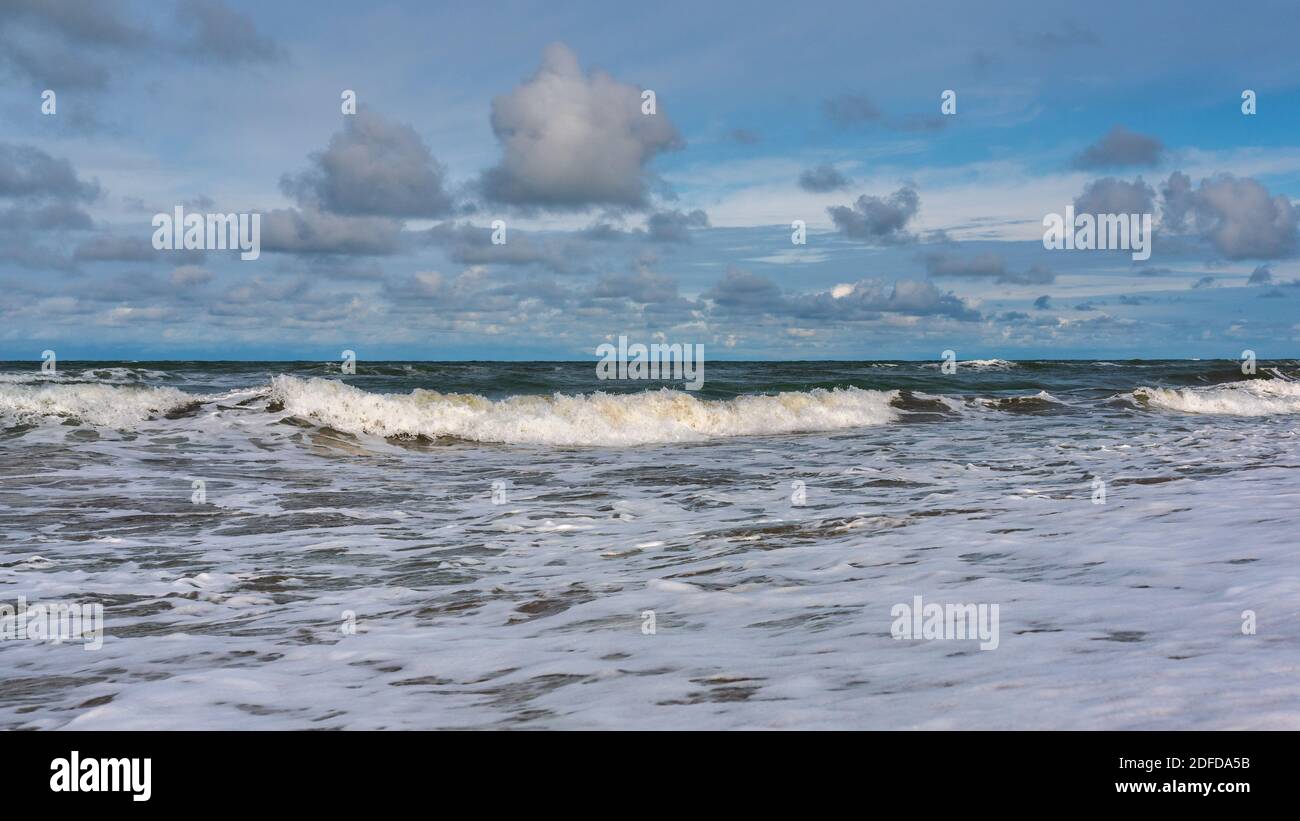 Tropical beach, small waves and blue sky with clouds Stock Photo - Alamy