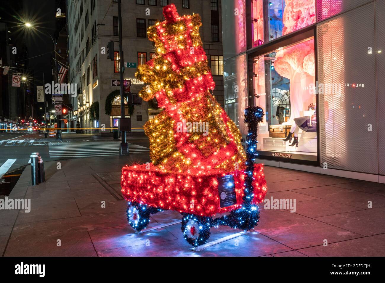New York, NY - December 3, 2020: Christmas decorations seen all around  Manhattan borough, dog in a cart Jolly Journey in front of Louis Vuitton  store Stock Photo - Alamy