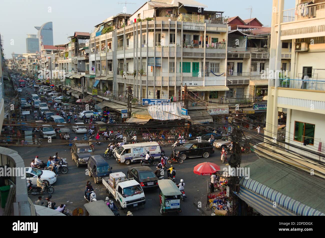 Phnom Penh, Cambodia - March, 2015: Traffic jam on a road intersection. Stuck in a traffic with crowd of motorbikes and car on the crossroad. Stock Photo