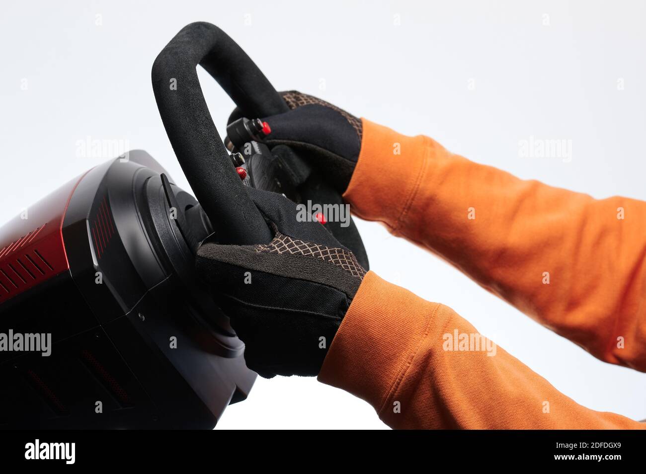 Hands on black sport car steering wheel side view isolated Stock Photo