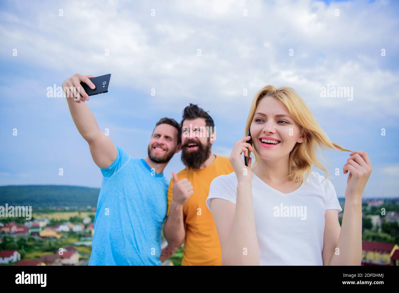 Friends Talking Using Phones Diverse female friends talking using hi-res stock photography and ...