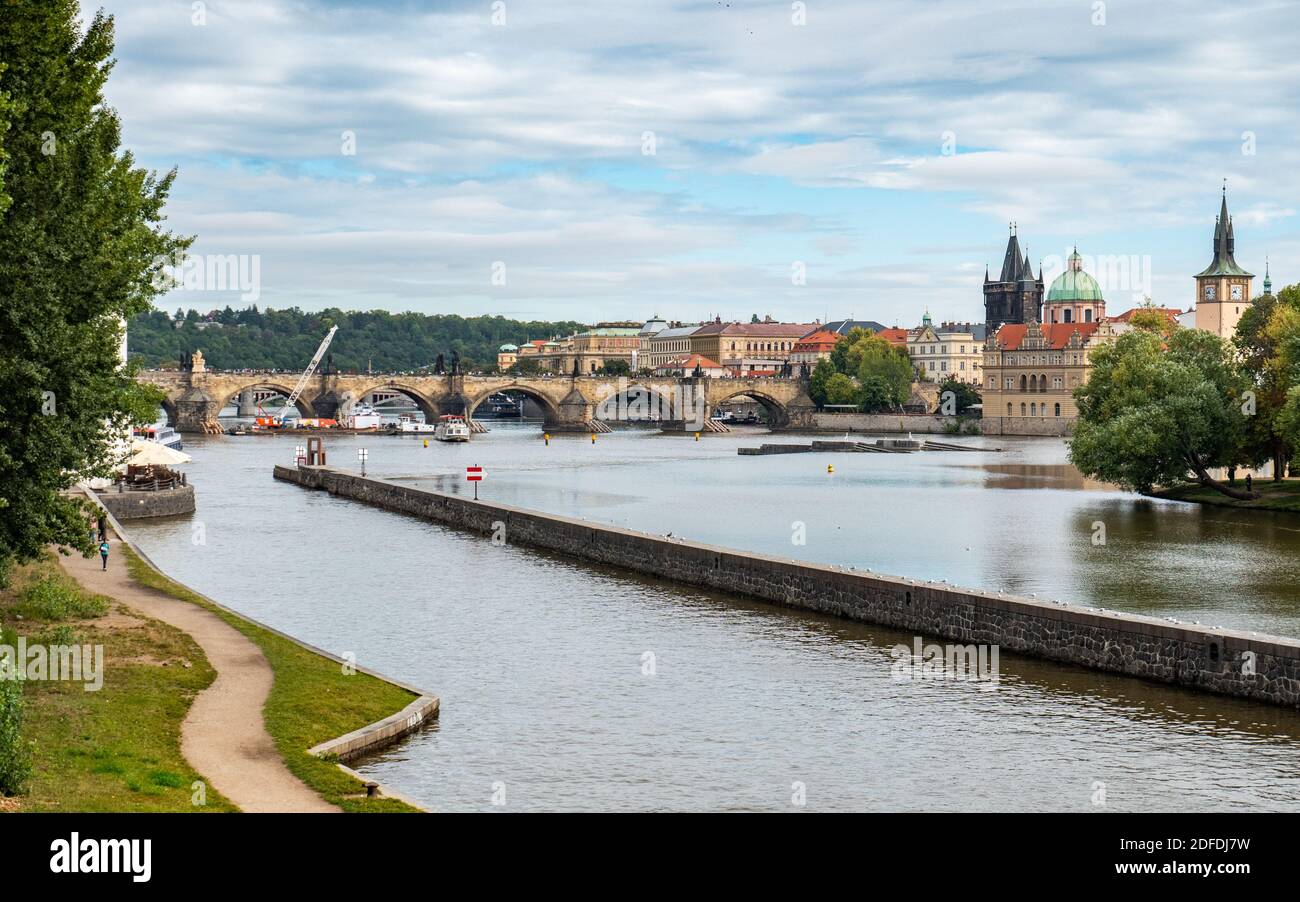 The Vlatava River, Prague, Czech Republic, with the landmark Charles Bridge and Old Town Bridge Tower in the distance. Stock Photo