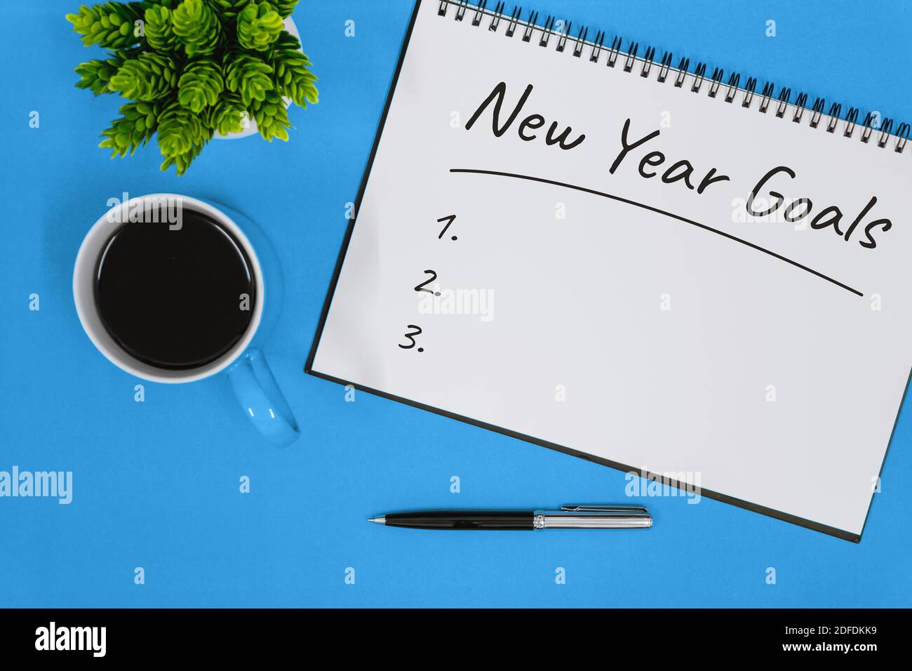 New Year Goals List on Notebook Stock Photo