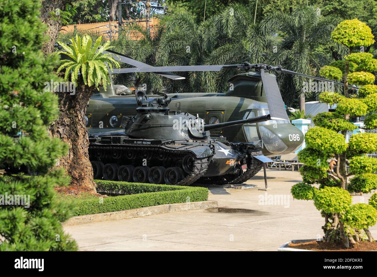 An American or US tank and helicopter outside the War Remnants Museum, a war museum, Ho Chi Minh City, Vietnam, Asia Stock Photo