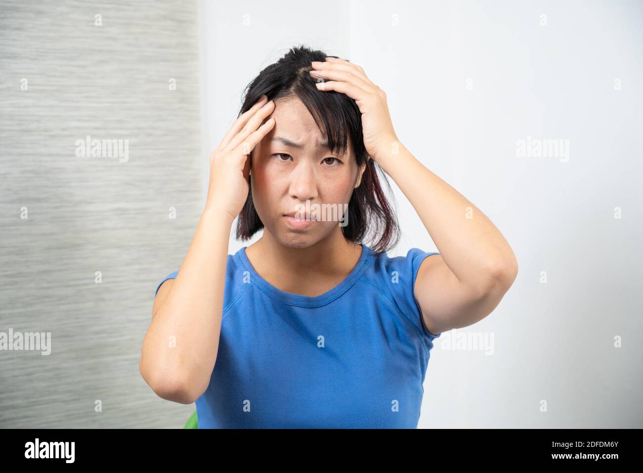Asian woman having headache. Stock Photo